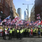Thousands join Tommy Robinson rally, as counter-protesters demonstrate