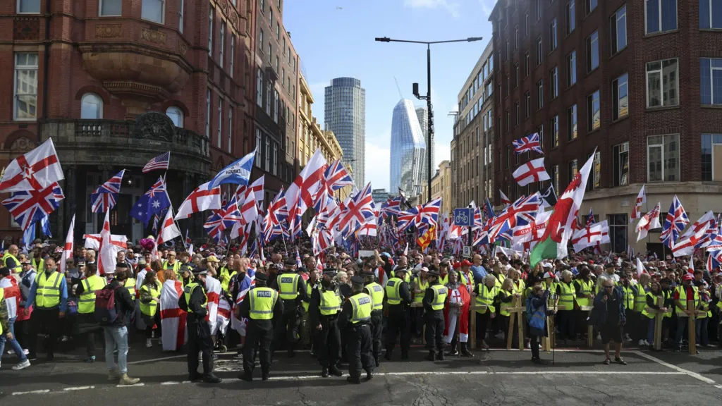 Thousands join Tommy Robinson rally, as counter-protesters demonstrate