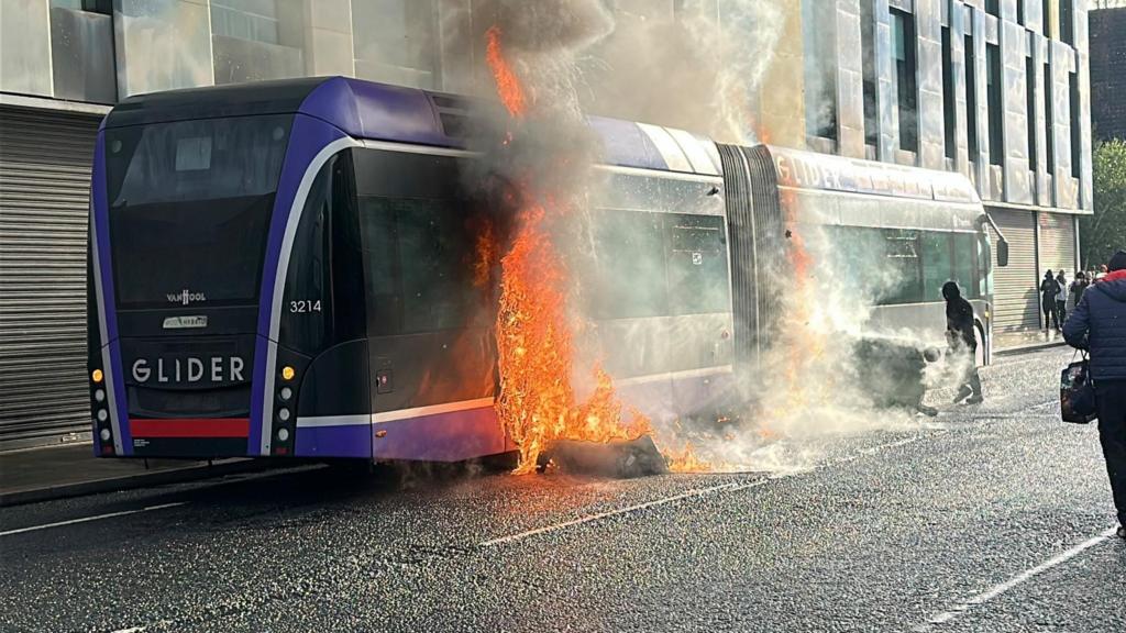 Bus set ablaze as disorder sweeps Belfast following knife attack